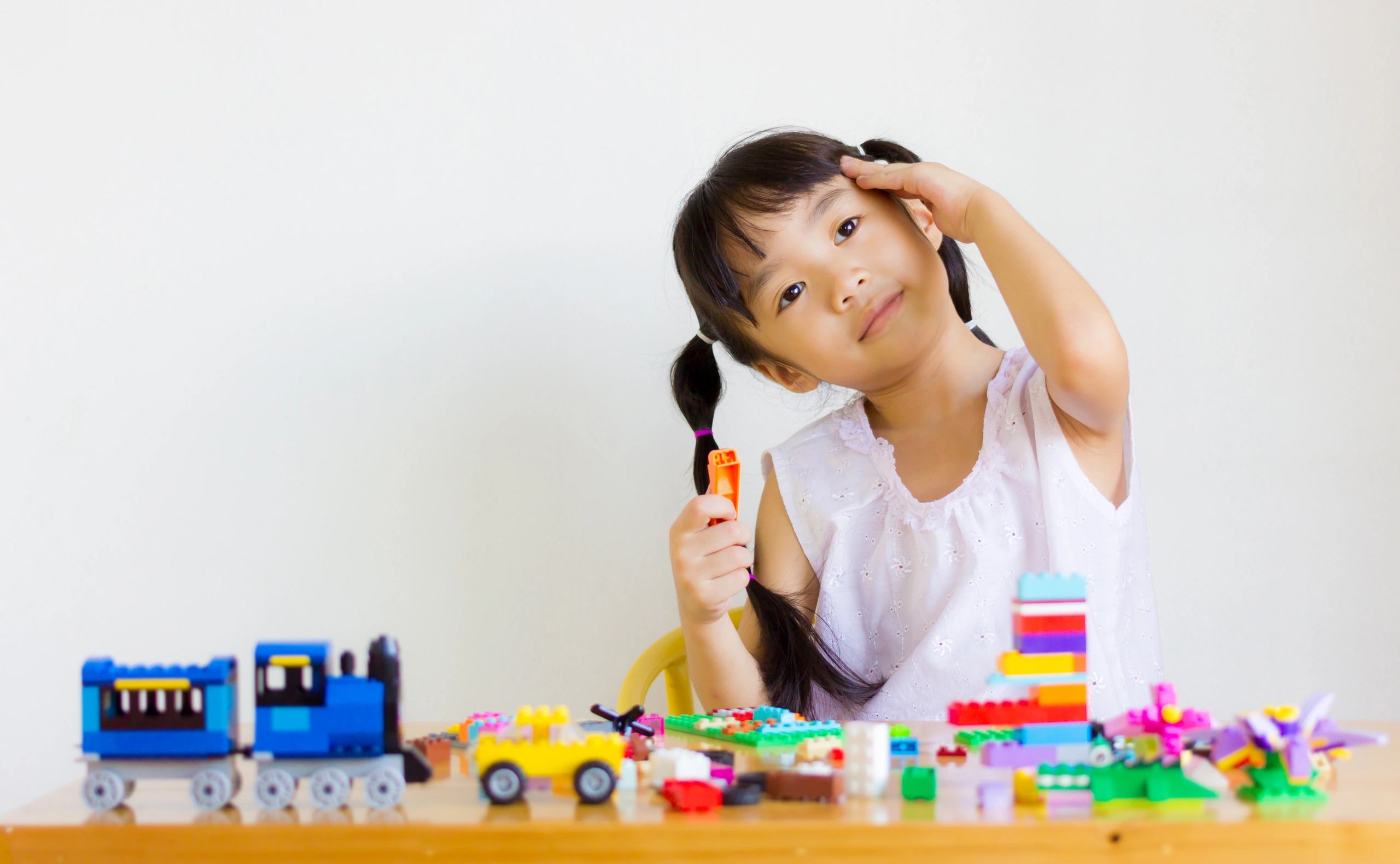 Child playing with lego