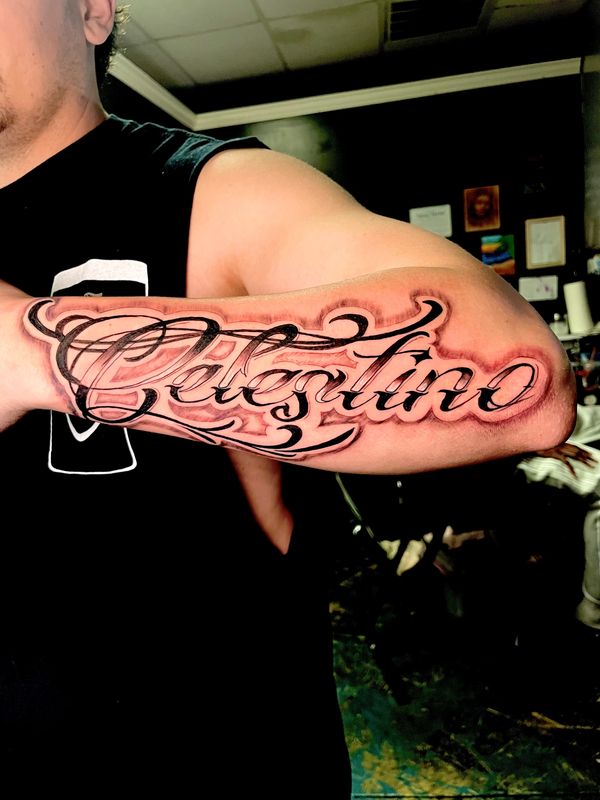 Forearm tattoo. Black and grey script tattoo. Permanent ink. Lone wolf tattoo charlotte Nc