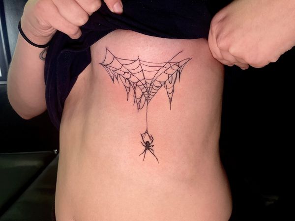 Underboob tattoo spider, goth , spiderwebs. Lone wolf tattoo charlotte nc