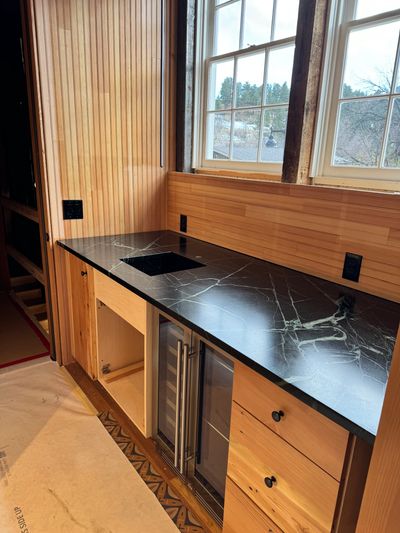 3CM Soapstone countertop with a custom stone sink located in Chautauqua Auditorium Boulder, CO.