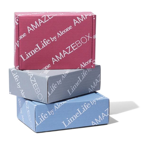 Stack of three colorful LimeLife by Alcone AMAZEBOX packages.
