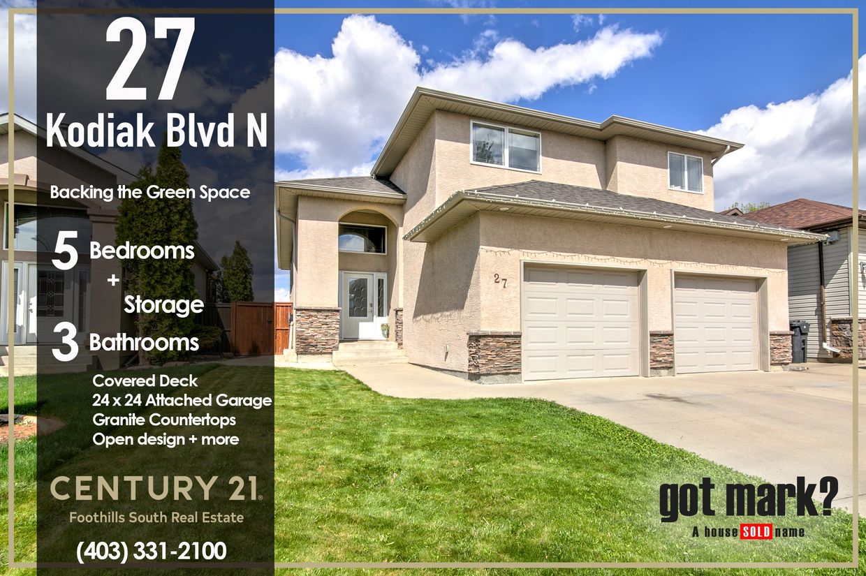 Spacious 5-bedroom home with attached garage and covered deck in a green space area.