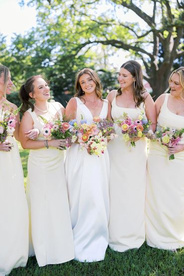 Bridal party with soft natural makeup and elegant hairstyles during wedding morning 