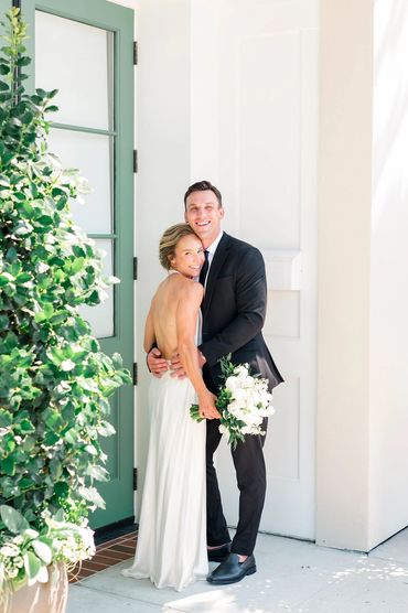 Charleston bride smiling with radiant natural bridal makeup and loose romantic hairstyle.