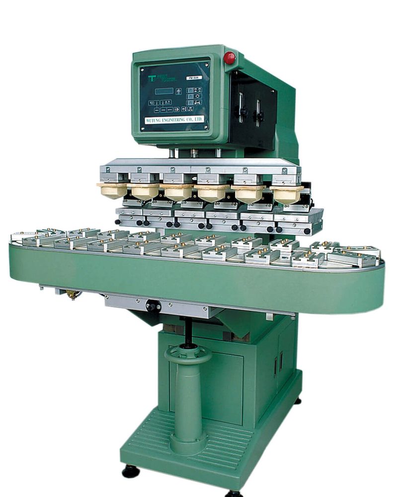 Green industrial machine with electronic control panel.