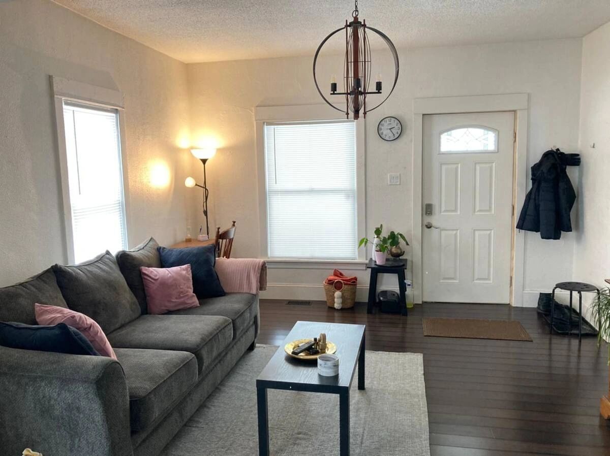 Cozy living room with gray sofa and minimalist decor.