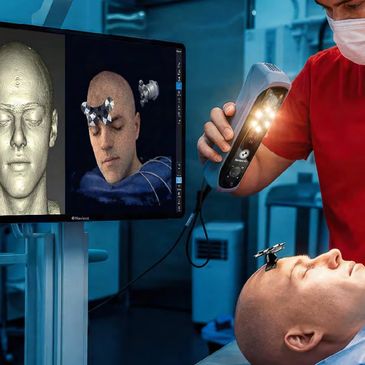 A medical professional scans a patient's head using advanced 3D imaging technology.