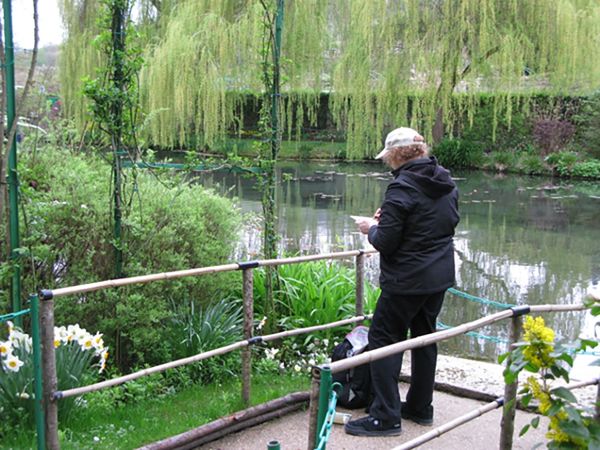 Photograph of Helaine painting in Monet’s Garden, Giverny France