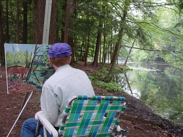 Photograph of Helaine painting at Yaddo, Saratoga Springs NY