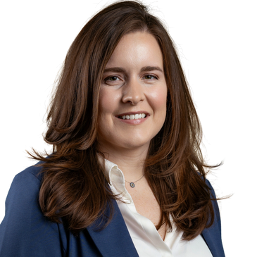 Professional woman with long brown hair wearing a blue blazer and white blouse.