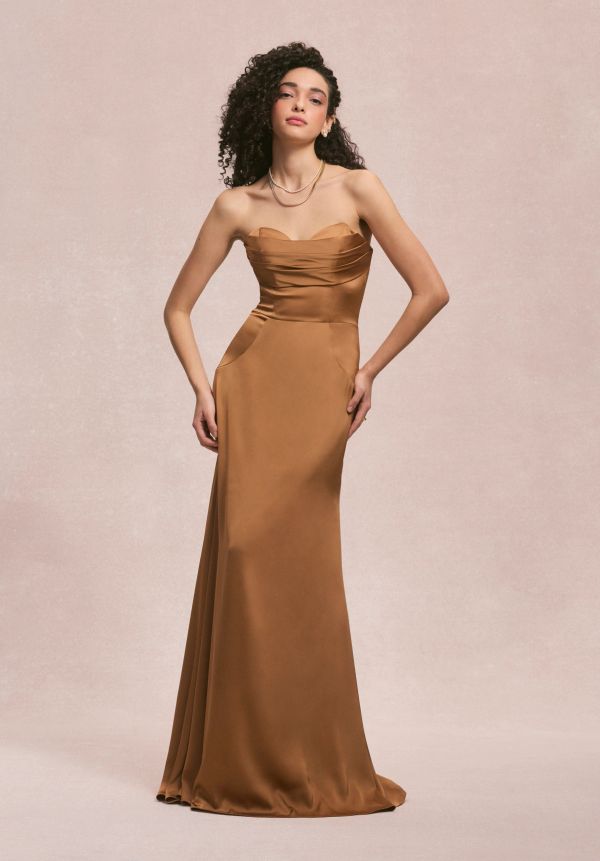 Woman in a sleek chestnut brown strapless gown.