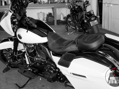 A black and white photo of two motorcycles sitting in the Mobster Auto Detail shop in Bristol, Va.