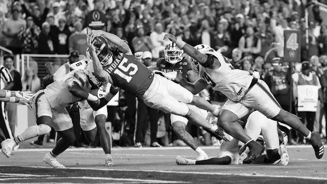 Indiana #15 dives for the goal line in an iconic, game-defining moment.