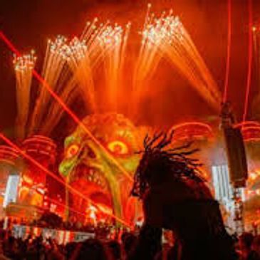 Vibrant Halloween-themed light show with a giant skull and lasers.