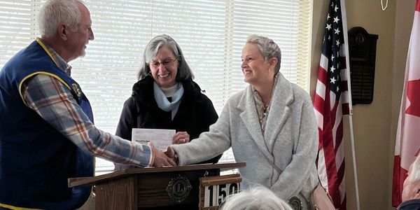 The Lake Chelan Community Services Council Present  the awarded Grant to Mike Tipton, President  of 