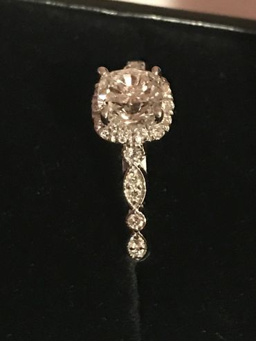 Close-up of a sparkling diamond ring with intricate detailing.
