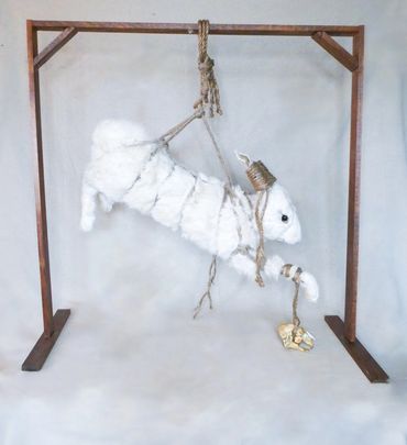 Bound rabbit with skull