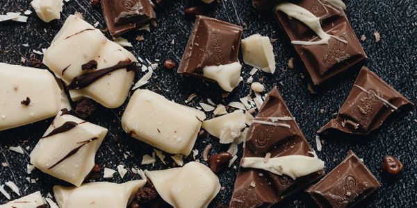 Broken milk and white chocolate pieces.