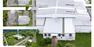 Aerial views of a white industrial building complex with surrounding greenery.