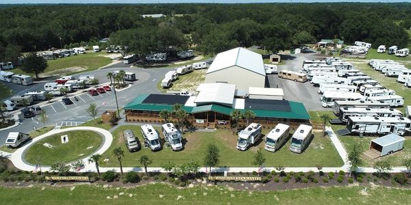 Aerial view of an RV sales and service center with multiple RVs parked.