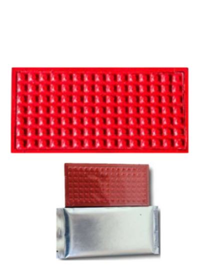 Red tactile rubber mats with metallic backing, designed for safety.