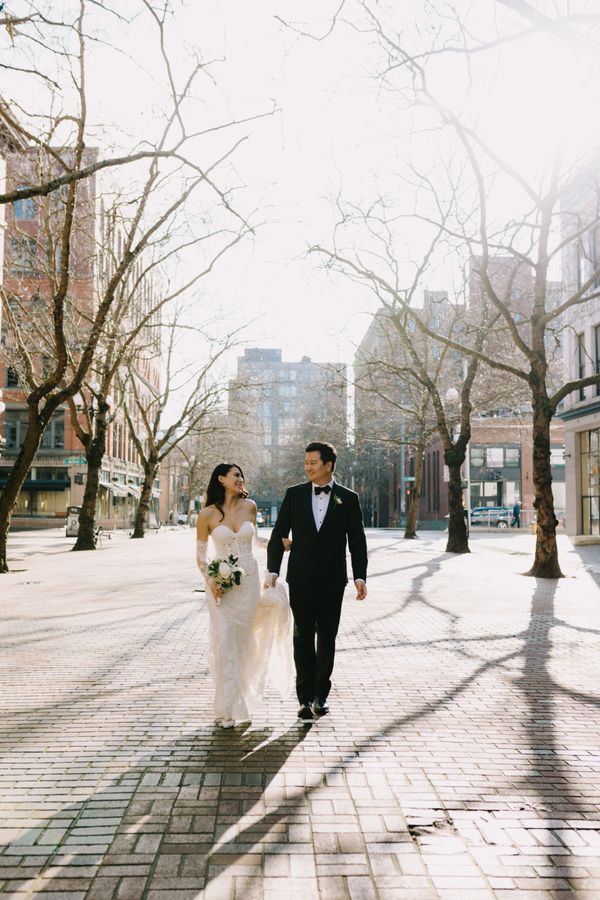 bride and groom pioneer square seattle white rose and babys breath bridal bouquet 