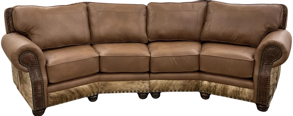 Brown leather corner sofa with studded details and cushioned seats.