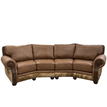 Brown leather sectional sofa with rolled arms and nailhead trim.