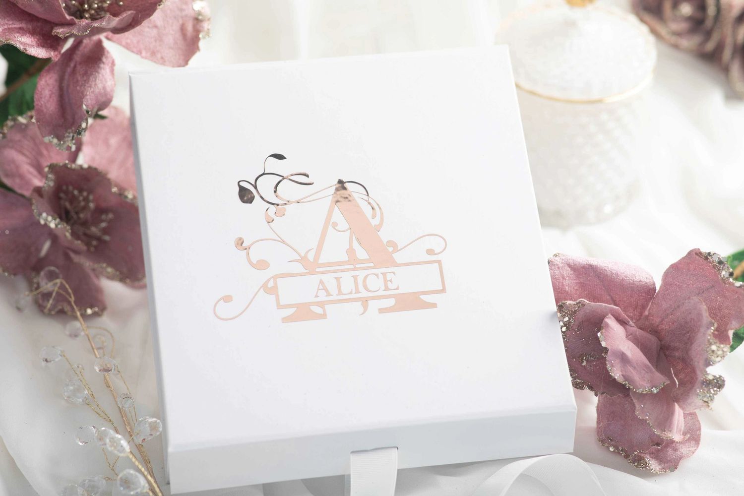 White gift box with ribbon decorated with a monogram and name decal in Champagne chrome