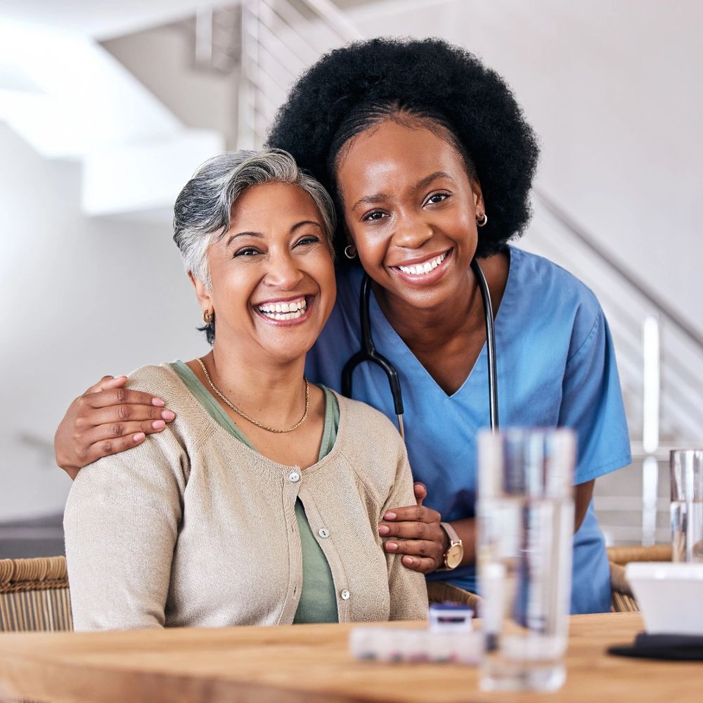 Smiling nurse with elderly patient sharing a warm moment.