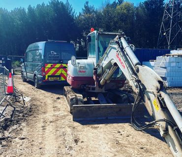 Takeuchi TB260 being serviced on-site in Staffordshire.