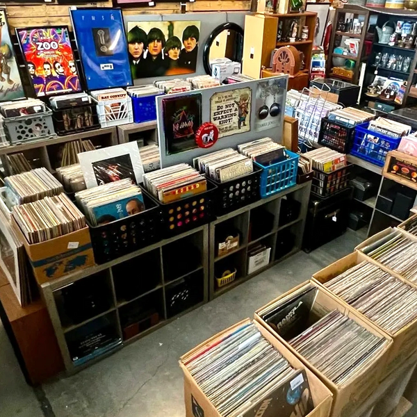 Vinyl records, record players, music, vintage 80s rock posters and a zippo lighter collection