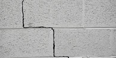 stair step crack in a concrete block foundation