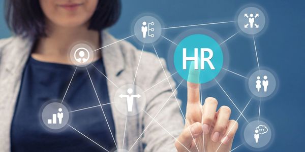 Woman placing her finger on HR text on screen