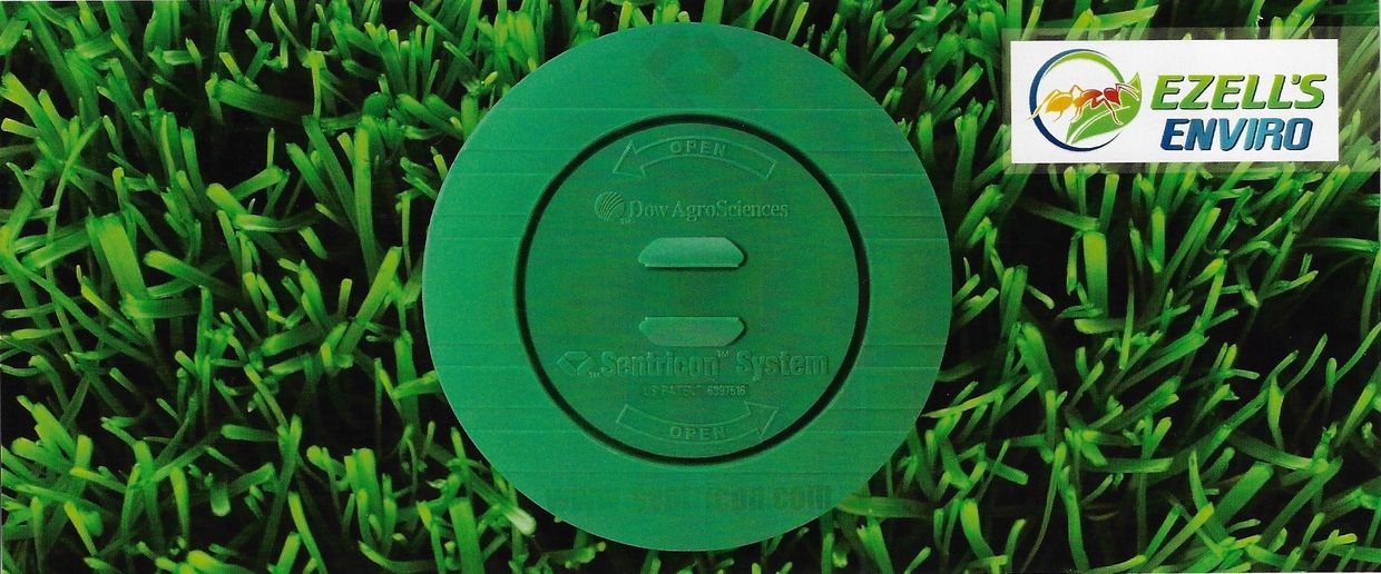 Green Sentricon System device on grass with Ezell's Enviro logo.