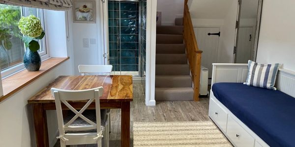 View of the sofa, table and two chairs