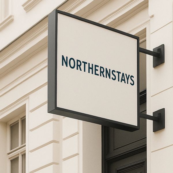 A colorful sunset over a calm ocean, with silhouettes of palm trees in the foreground.
