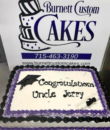 Custom graduation cake congratulating Uncle Jerry with purple and black decorations.