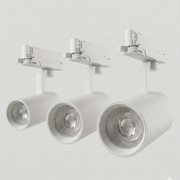 Three white ceiling spotlights of different sizes.