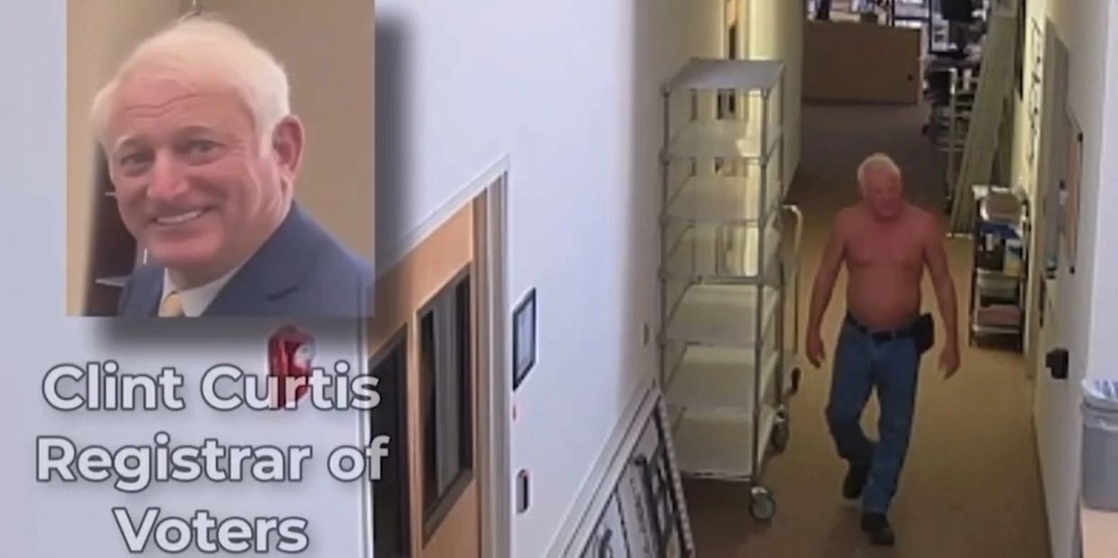 Clint Curtis shirtless in the office of the Shasta County Registrar of Voters