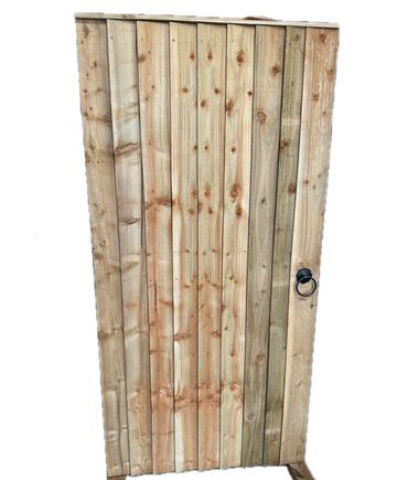 Wooden garden gate with a metal ring handle.