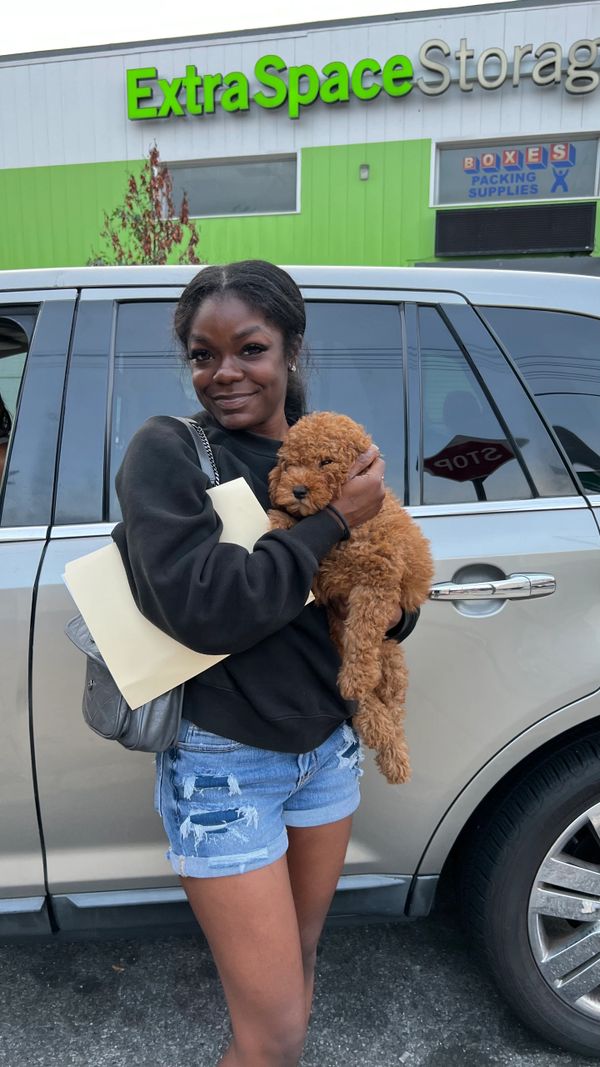 Woman holding her new puppy