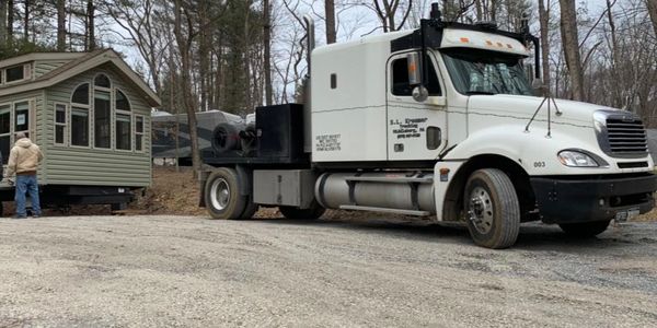 S.L. Kreamer Trucking truck moving a tiny home.