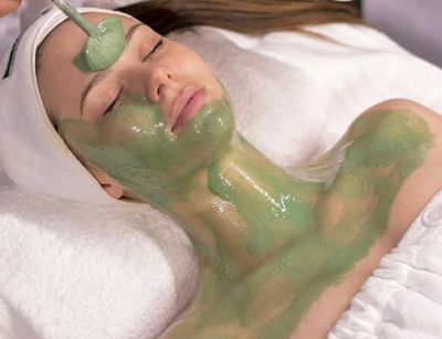 A relaxed woman receiving a muscle banding treatment 