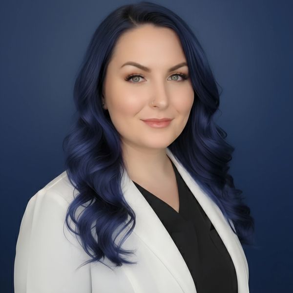 A professional headshot of Jessica Williams in her labcoat