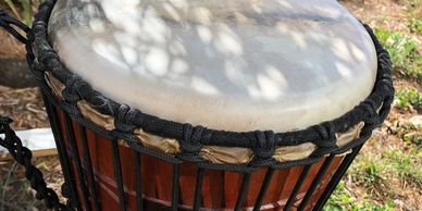 a drum in the grass, used for drumbeat therapy