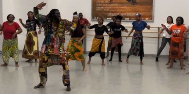 Group dance class with African-inspired attire.