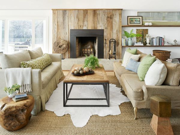 Cozy living room with neutral tones and rustic wood accents.