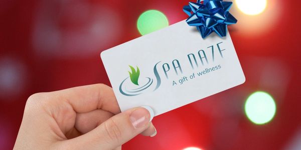 photo of hand holding spa daze gift card