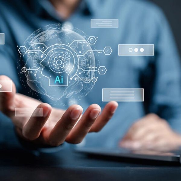 Person holding a digital AI interface hologram above their hand.